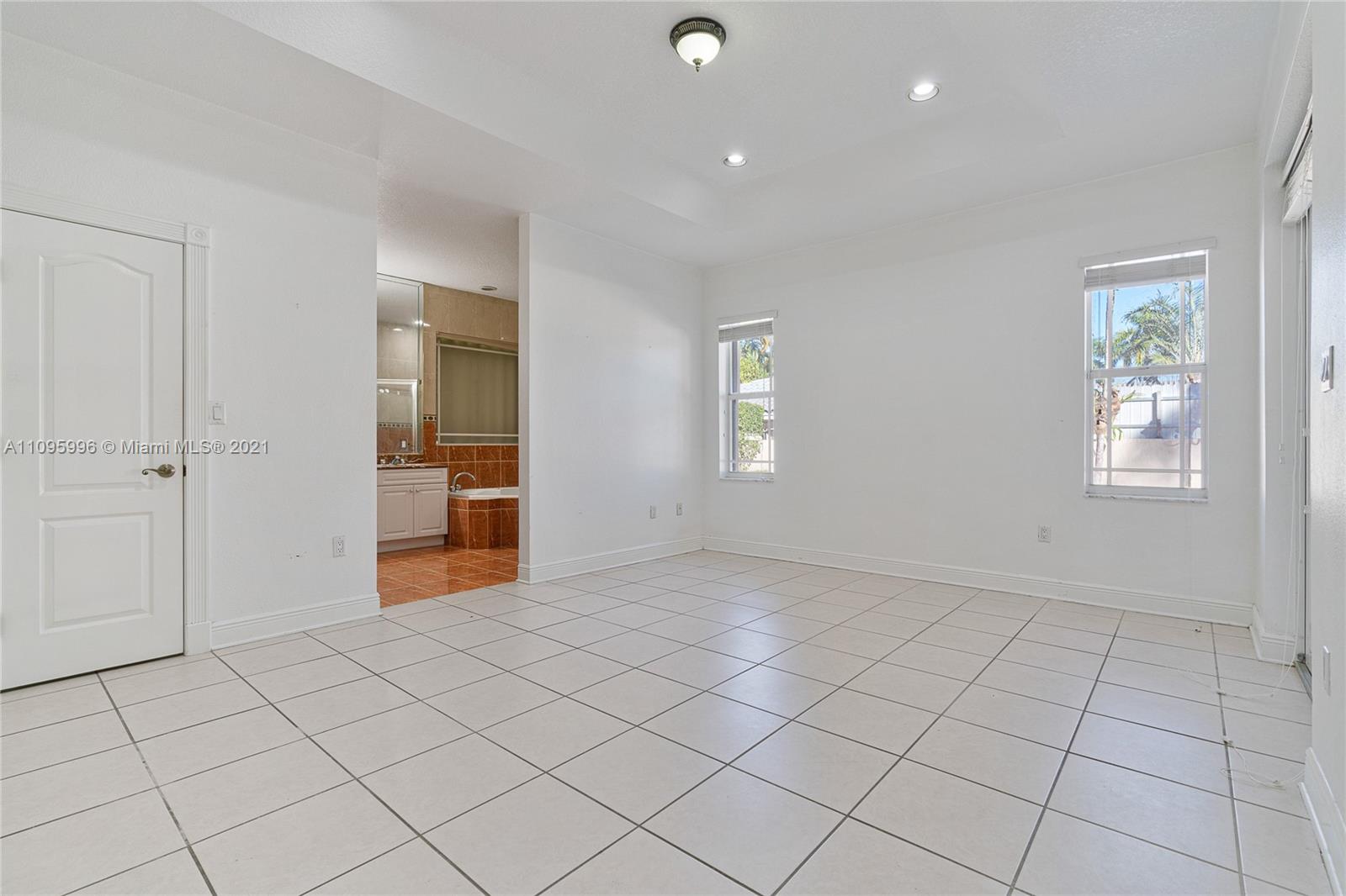 3671 Southwest 139th Court Miami, FL 33175 - Photo 28 of 56 an empty room with windows and closet