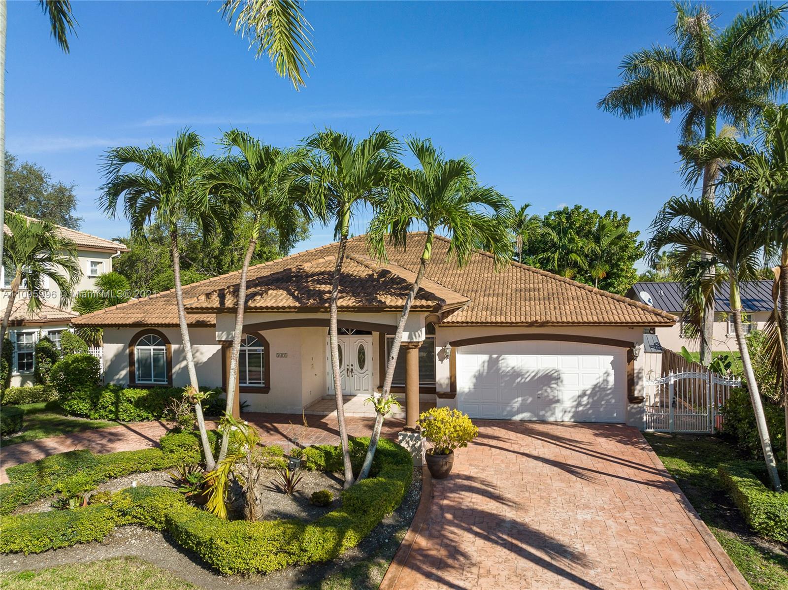 3671 Southwest 139th Court Miami, FL 33175 - Photo 3 of 56 a front view of a house with garden