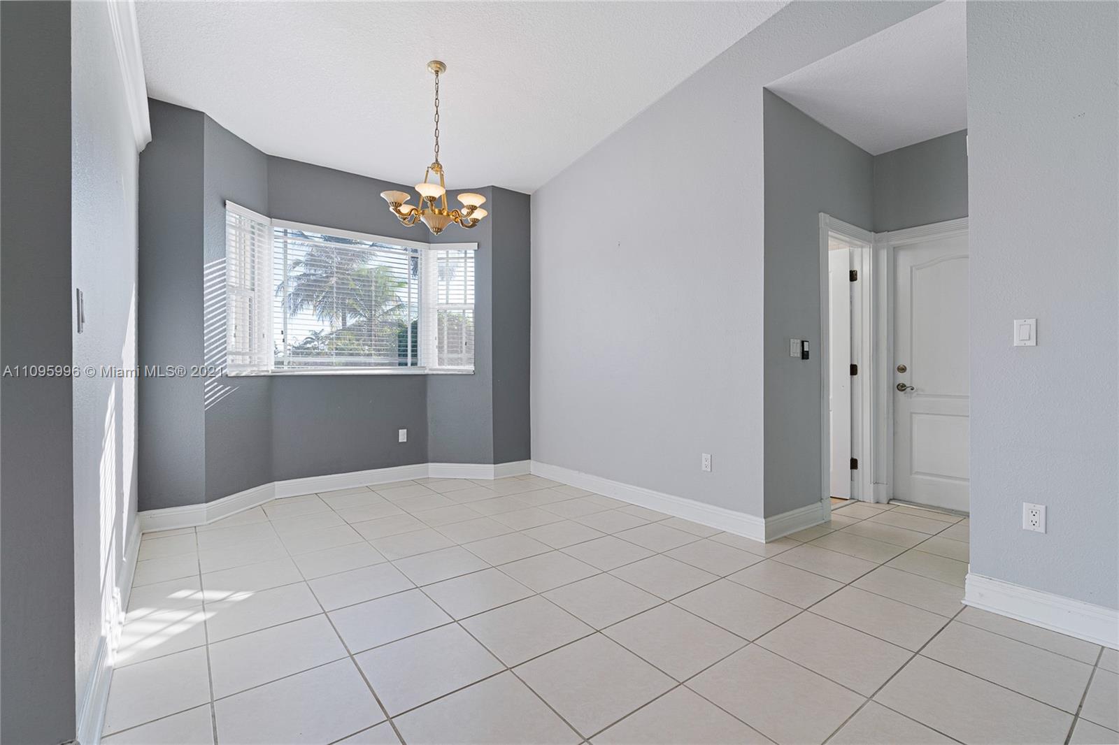 3671 Southwest 139th Court Miami, FL 33175 - Photo 33 of 56 a view of an empty room with window and cabinet