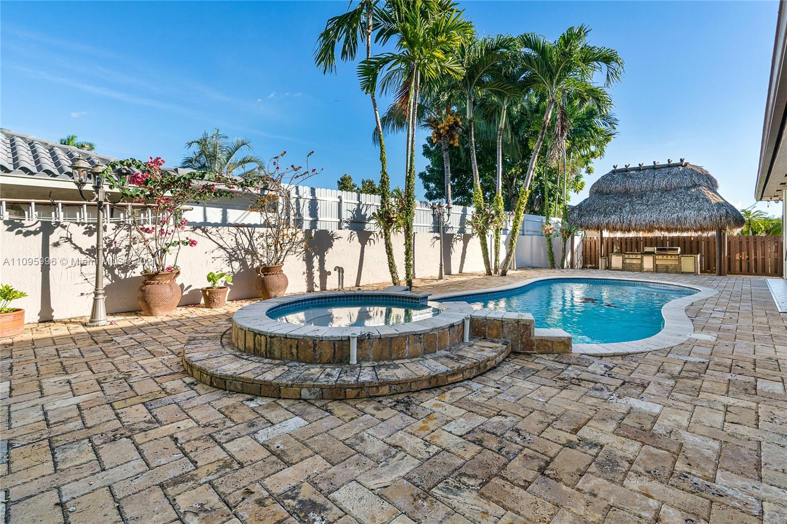 3671 Southwest 139th Court Miami, FL 33175 - Photo 44 of 56 a view of a swimming pool with a patio