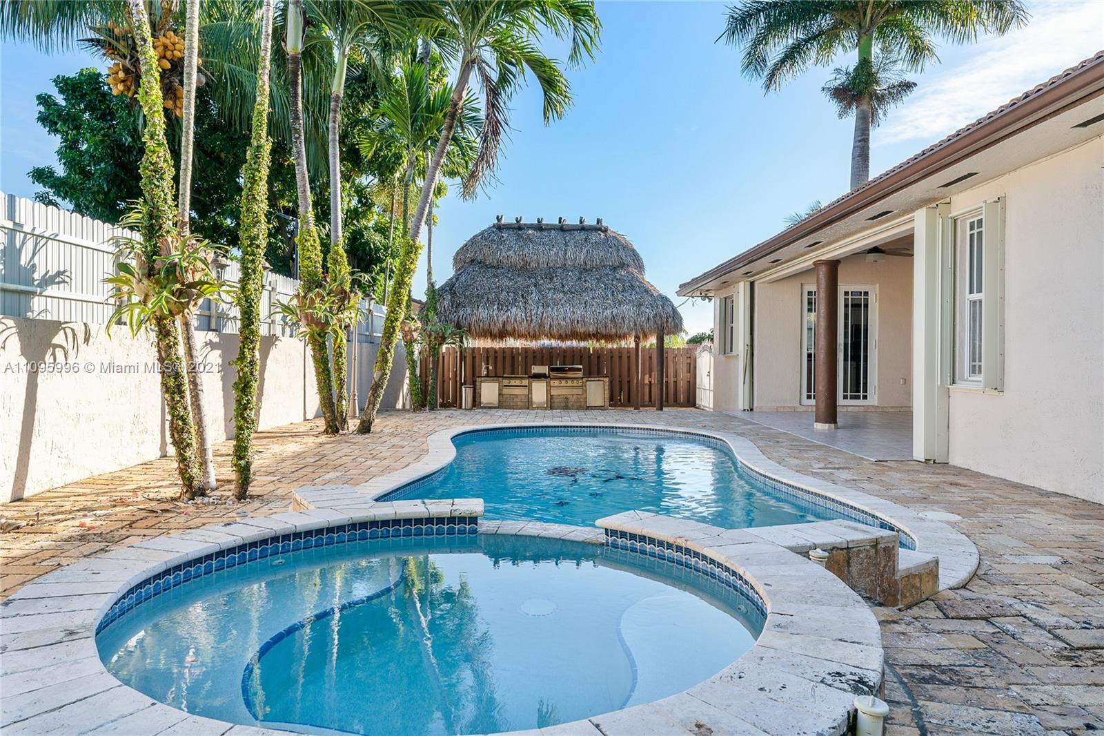 3671 Southwest 139th Court Miami, FL 33175 - Photo 45 of 56 a view of a swimming pool with a patio