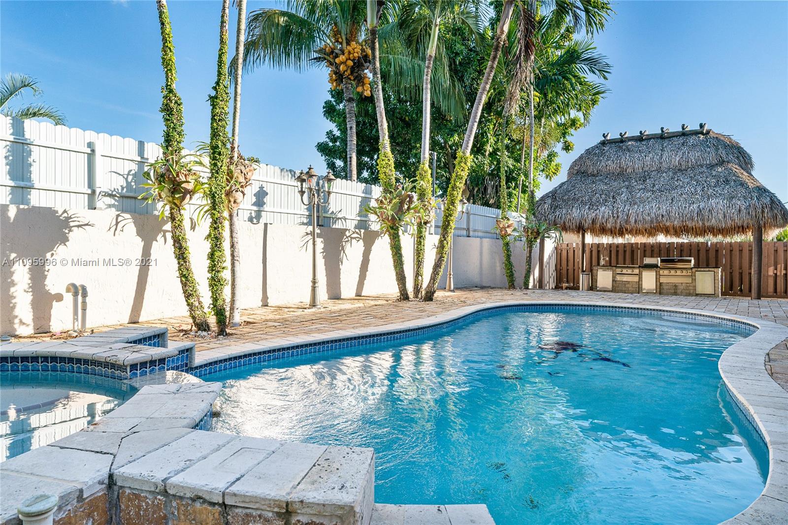 3671 Southwest 139th Court Miami, FL 33175 - Photo 46 of 56 a swimming pool with outdoor seating and yard