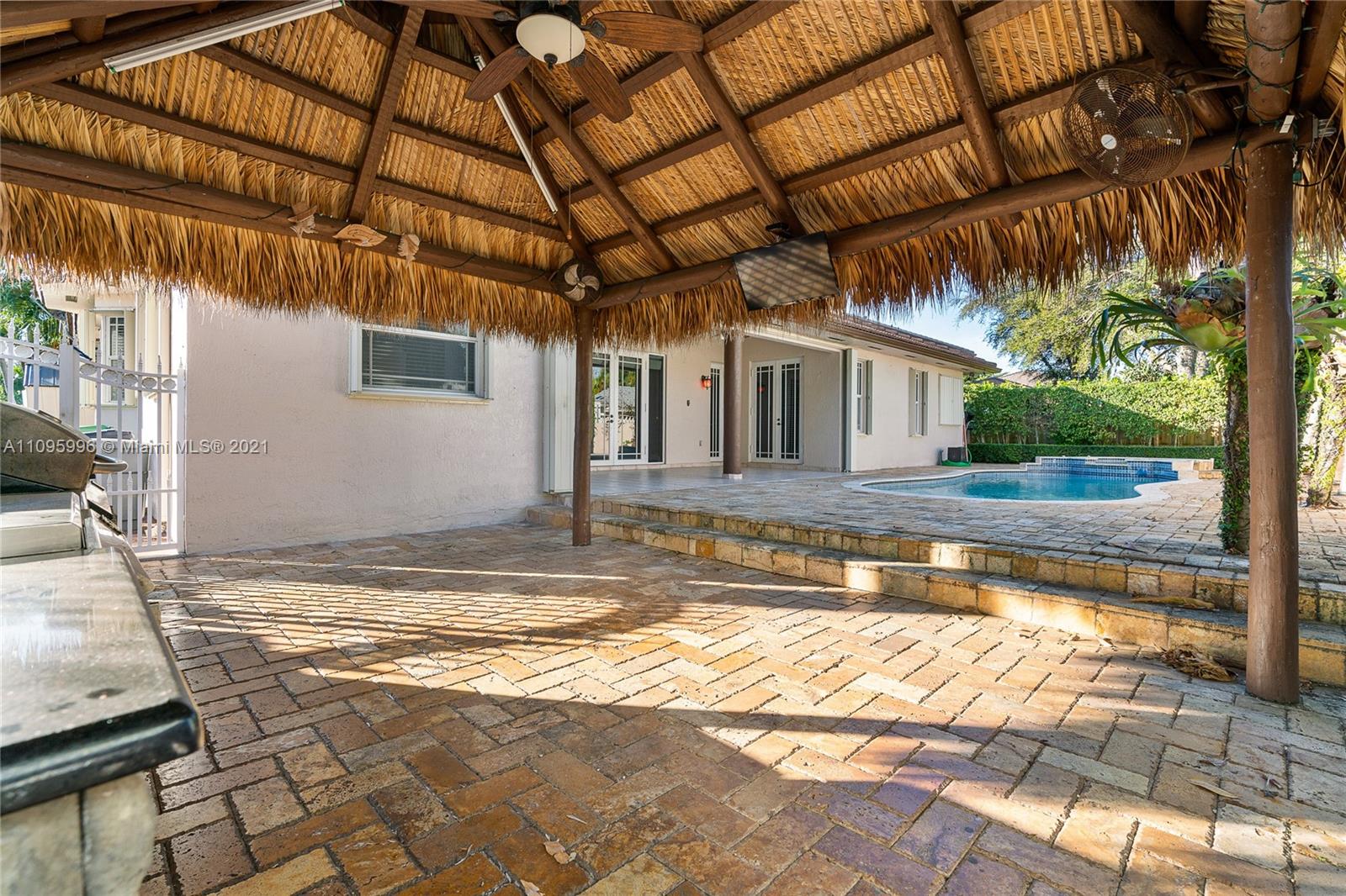 3671 Southwest 139th Court Miami, FL 33175 - Photo 52 of 56 a view of a house with a swimming pool