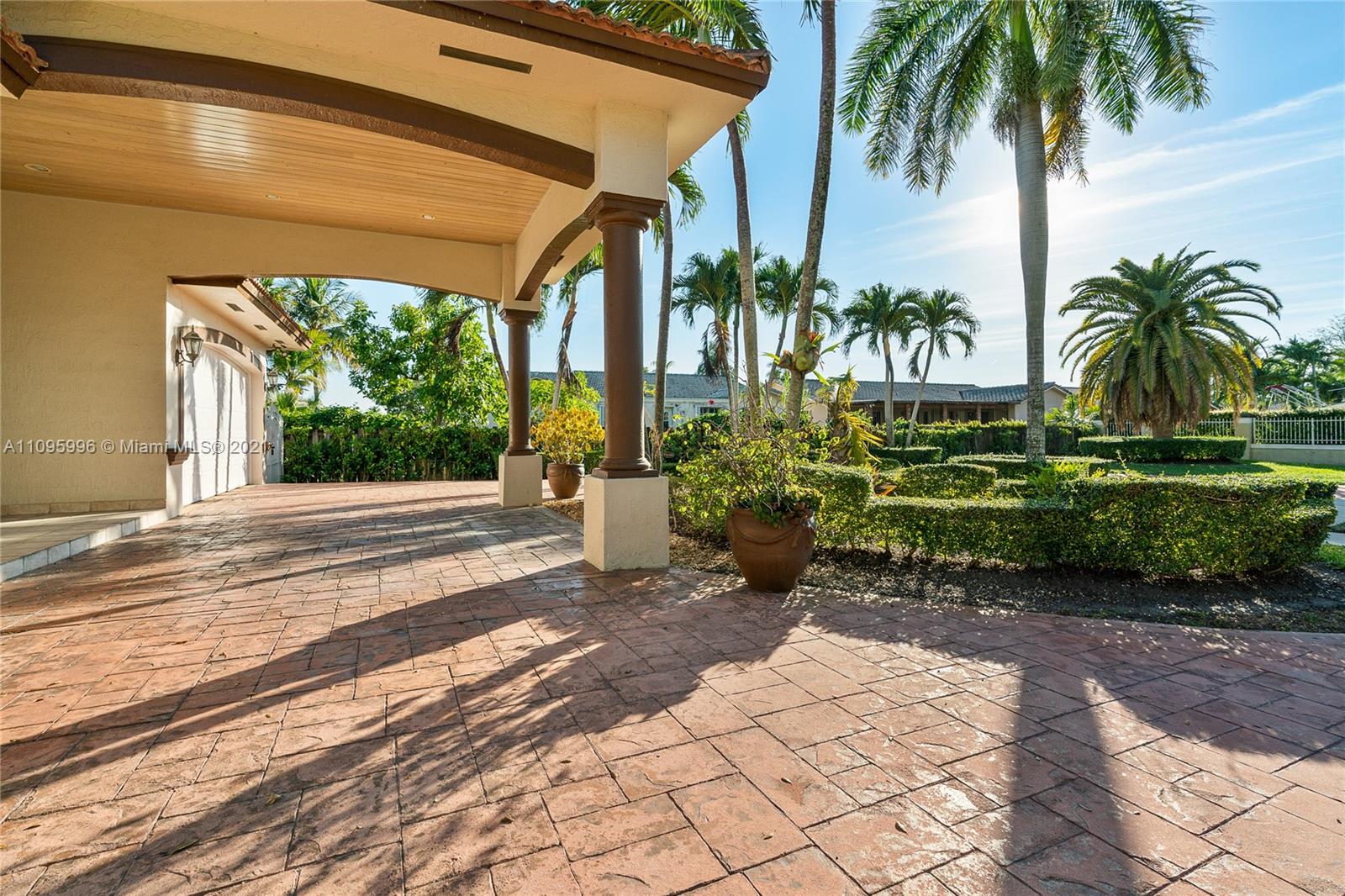 3671 Southwest 139th Court Miami, FL 33175 - Photo 56 of 56 a couple of palm trees in front of yellow house