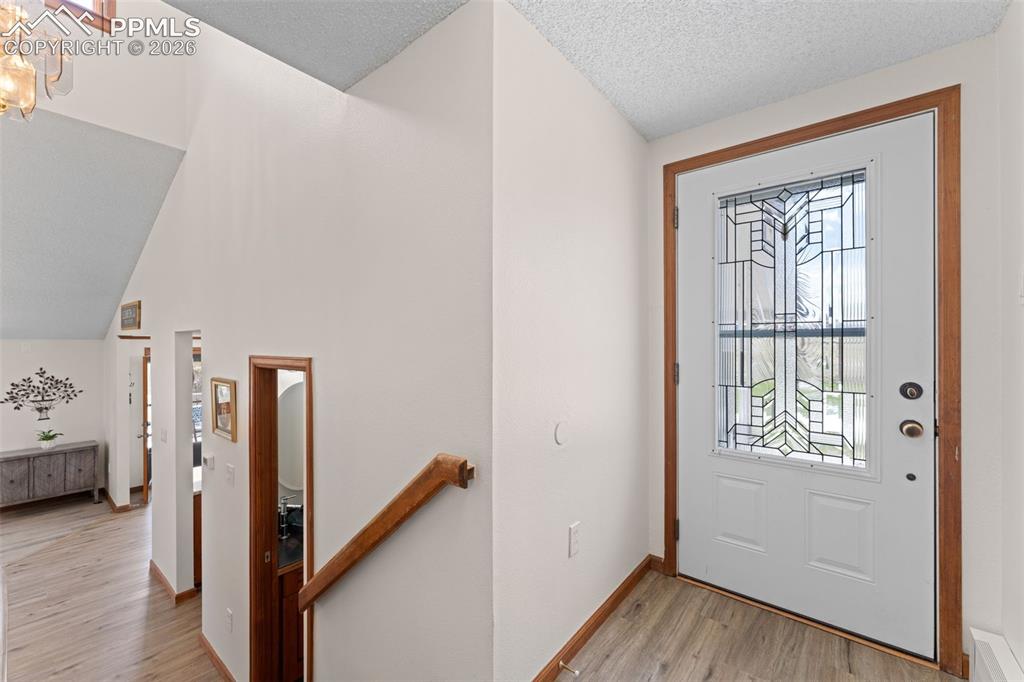 1851 Buttercup Road Elizabeth, CO 80107 - Photo 4 of 47 a view of a hallway with a wooden floor and entryway