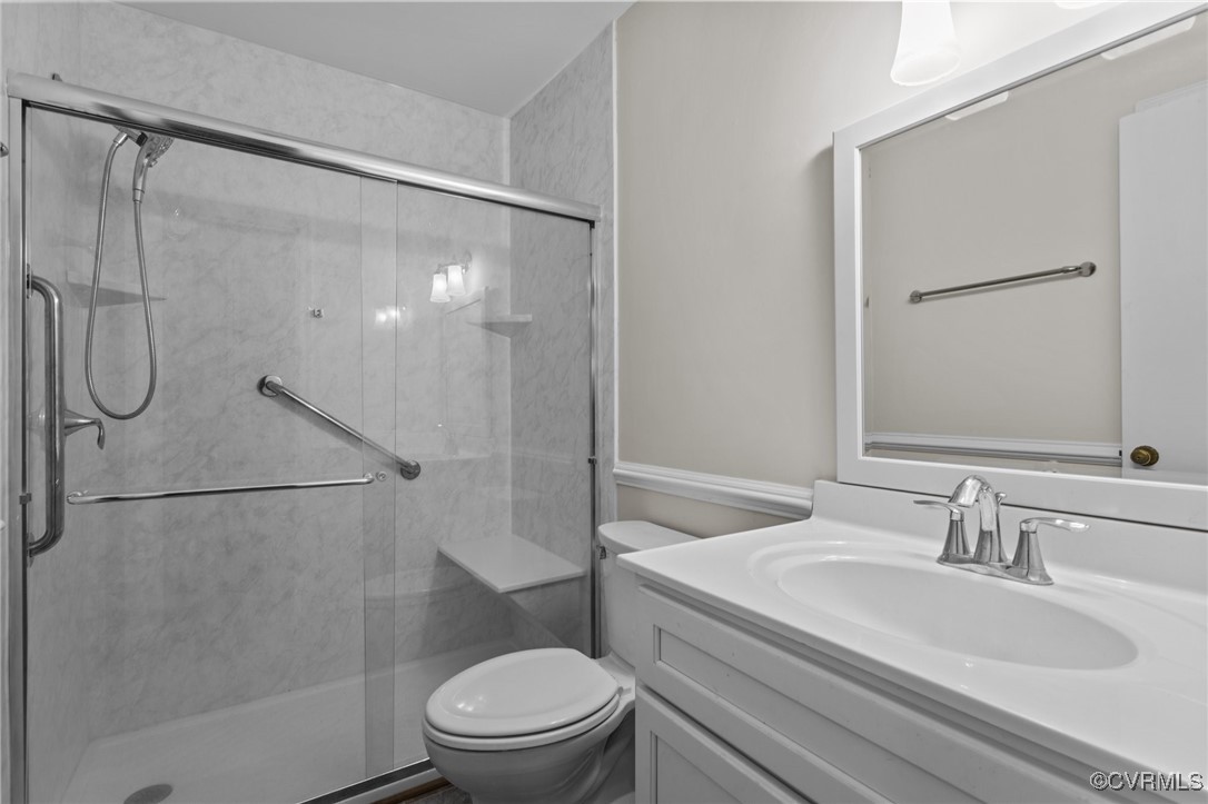 4232 Laurel Oak Road North Chesterfield, VA 23237 - Photo 13 of 45 Bathroom featuring a stall shower, vanity, and toi