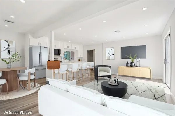 a living room with furniture and a table