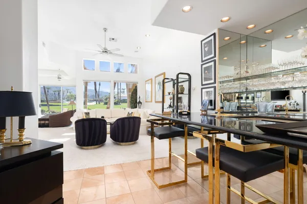 a view of a living room and chandelier