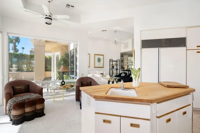 a view of a swimming pool with a lounge chairs