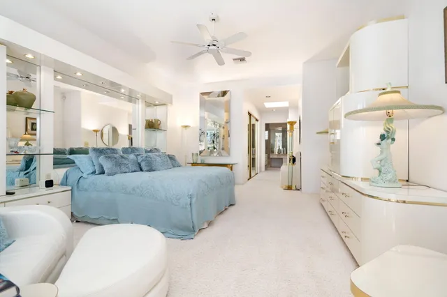 a bathroom with a granite countertop sink mirror and a