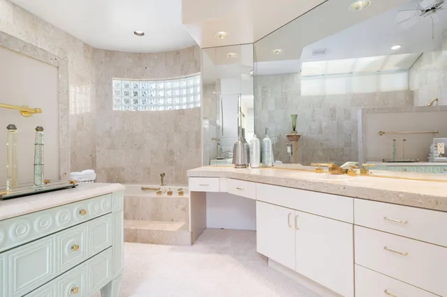 a bathroom with a tub a sink and a shower curtain