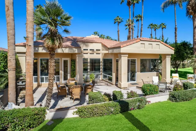 a view of multiple houses with yard
