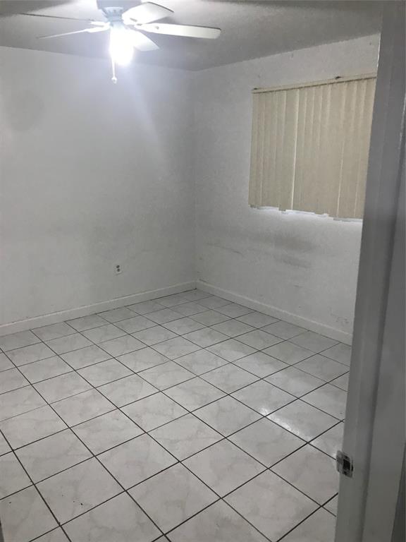 161 Northwest 164th Street, Unit 3 Miami, FL 33169 - Photo 6 of 8 a view of an empty room