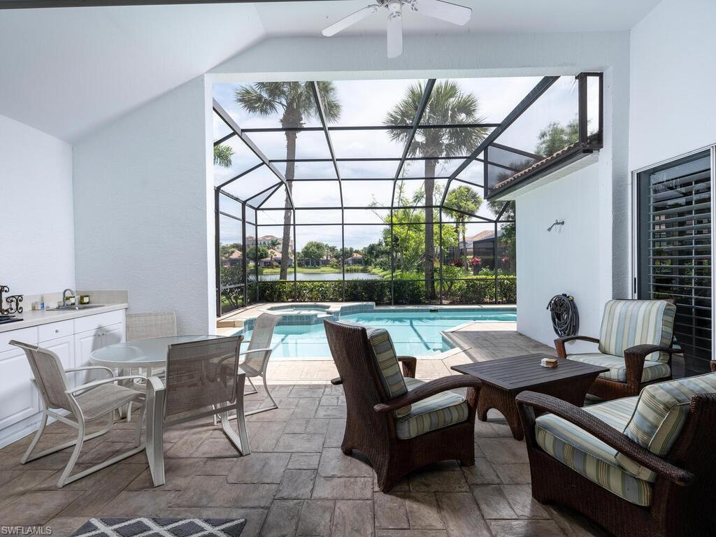 8846 Ventura Drive Naples, FL 34109 - Photo 14 of 18 a view of a dining room with furniture window and outside view