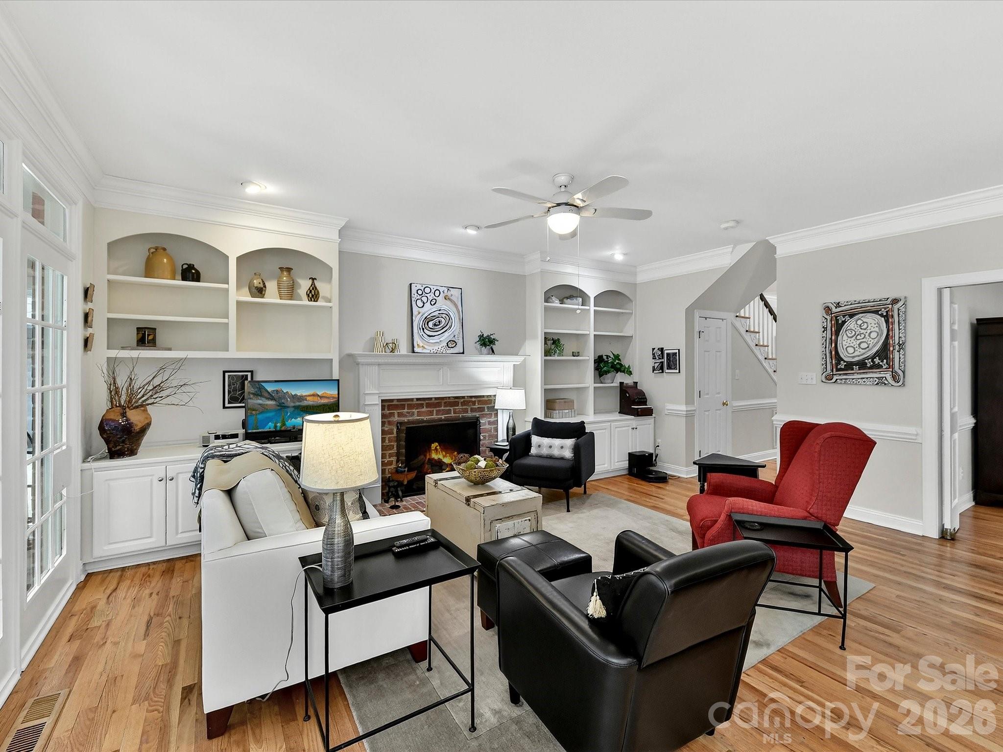 207 Hobbs Street Davidson, NC 28036 - Photo 12 of 40 a living room with furniture and a fireplace