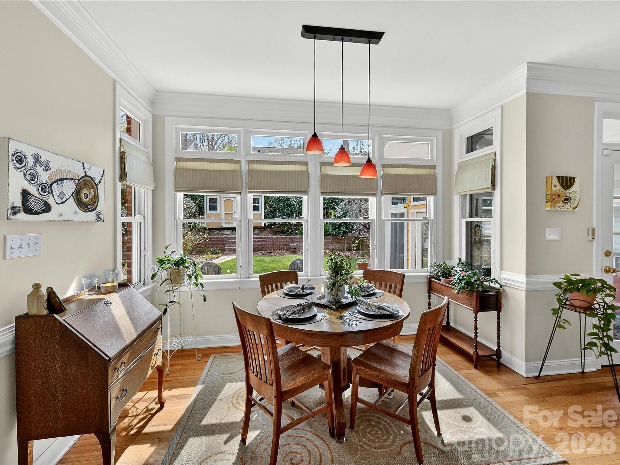 207 Hobbs Street Davidson, NC 28036 - Photo 14 of 40 a view of a dining room with furniture window and outside view