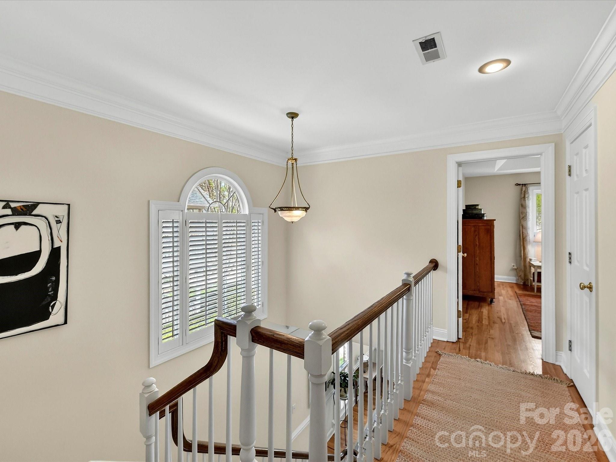 207 Hobbs Street Davidson, NC 28036 - Photo 17 of 40 a view of a hallway with windows
