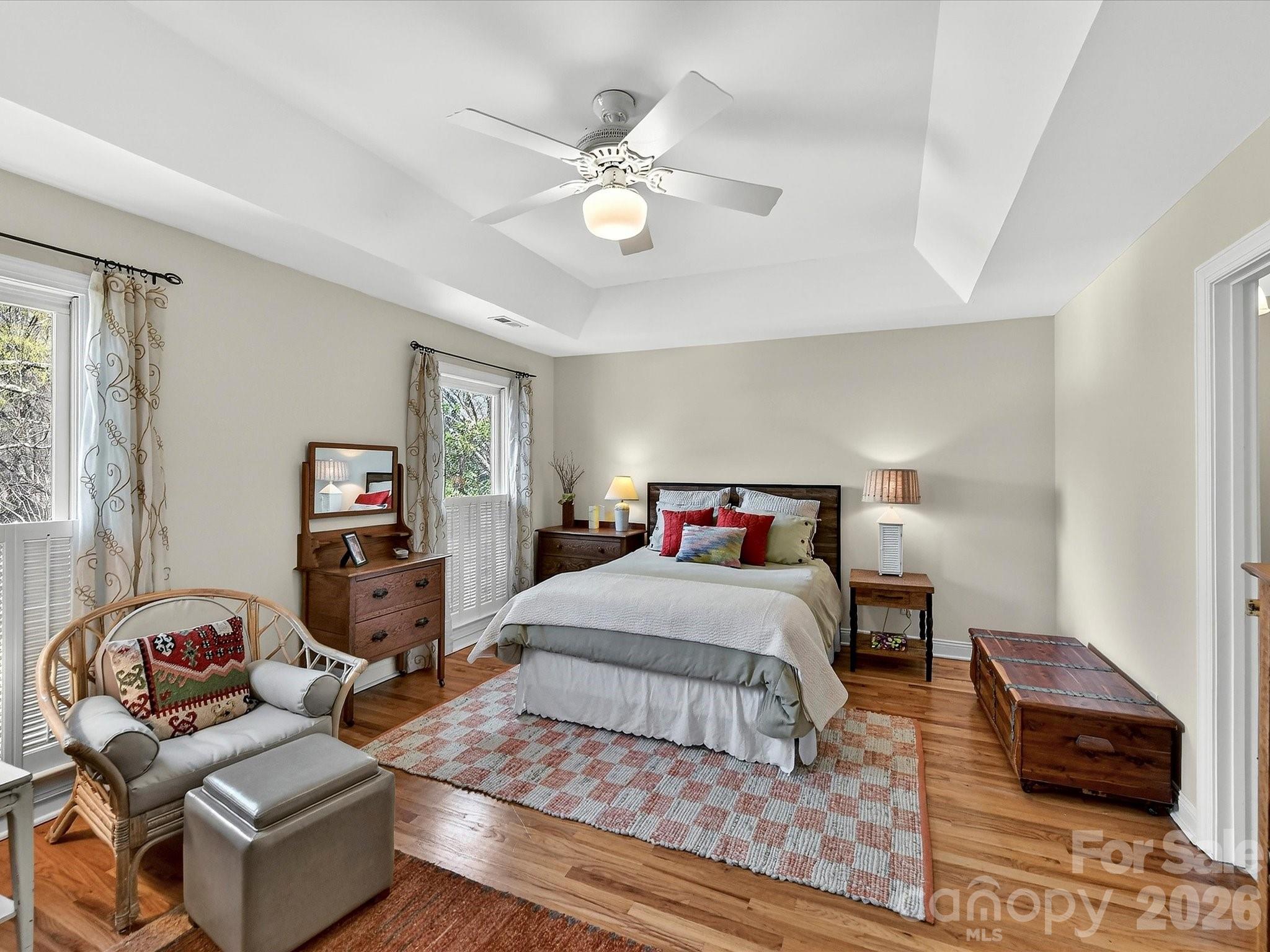 207 Hobbs Street Davidson, NC 28036 - Photo 18 of 40 a bedroom with a bed and wooden floor