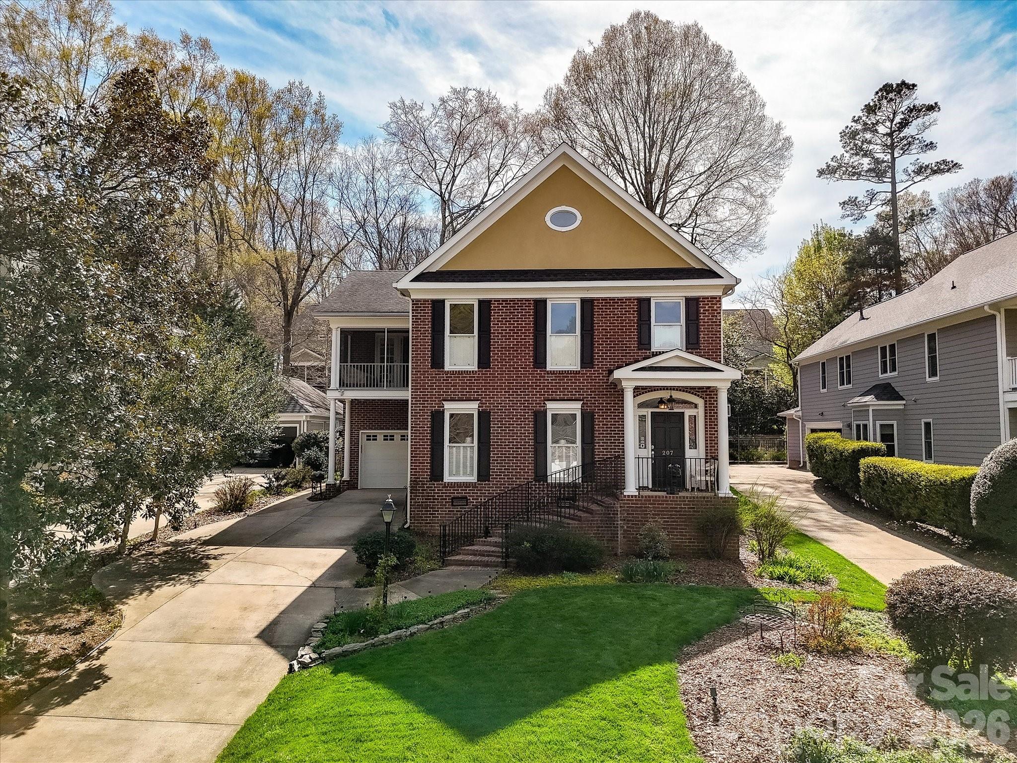 207 Hobbs Street Davidson, NC 28036 - Photo 2 of 40 a front view of a house with a yard