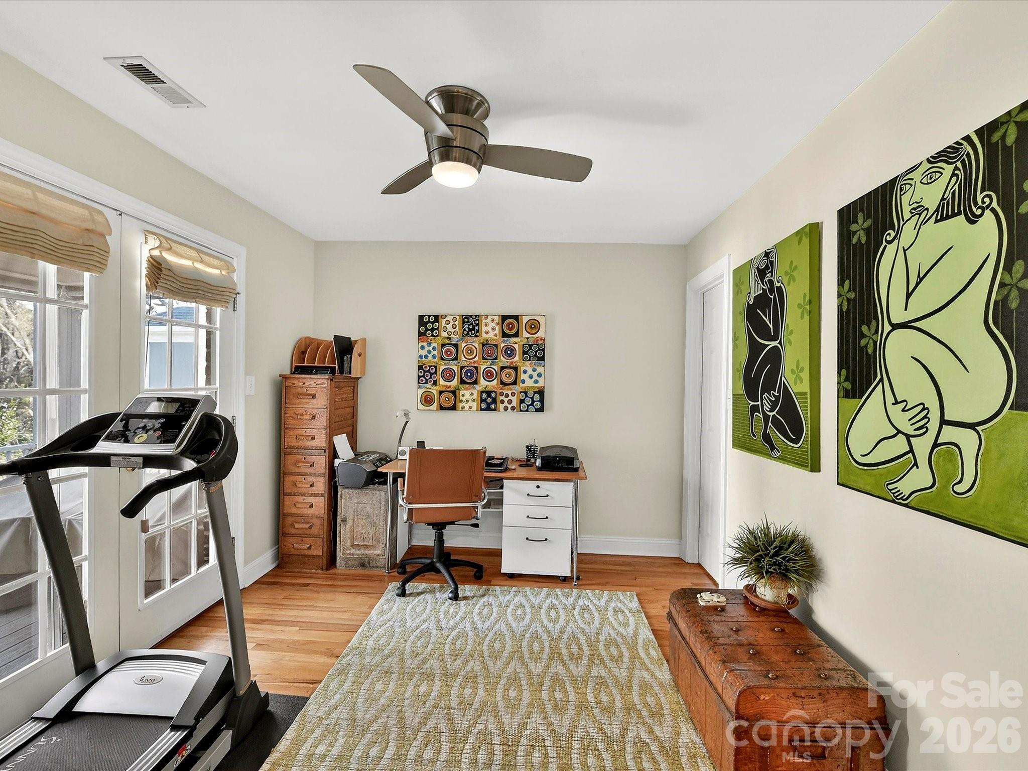 207 Hobbs Street Davidson, NC 28036 - Photo 22 of 40 a living room with furniture and a rug