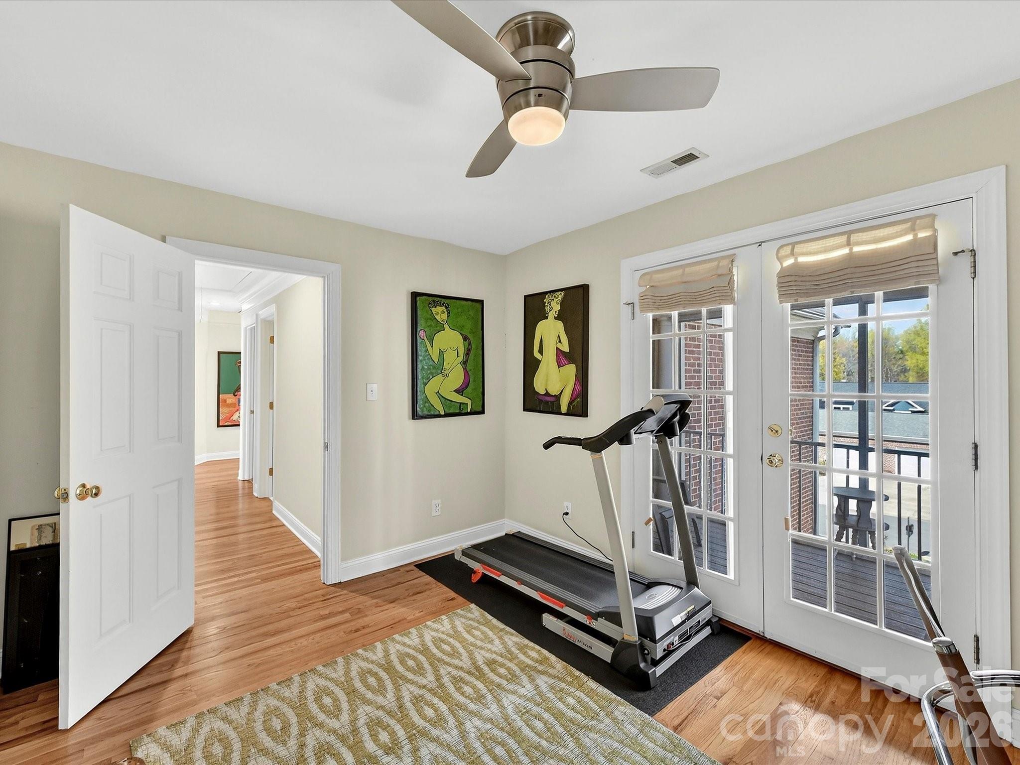 207 Hobbs Street Davidson, NC 28036 - Photo 23 of 40 a view of a room with gym equipment