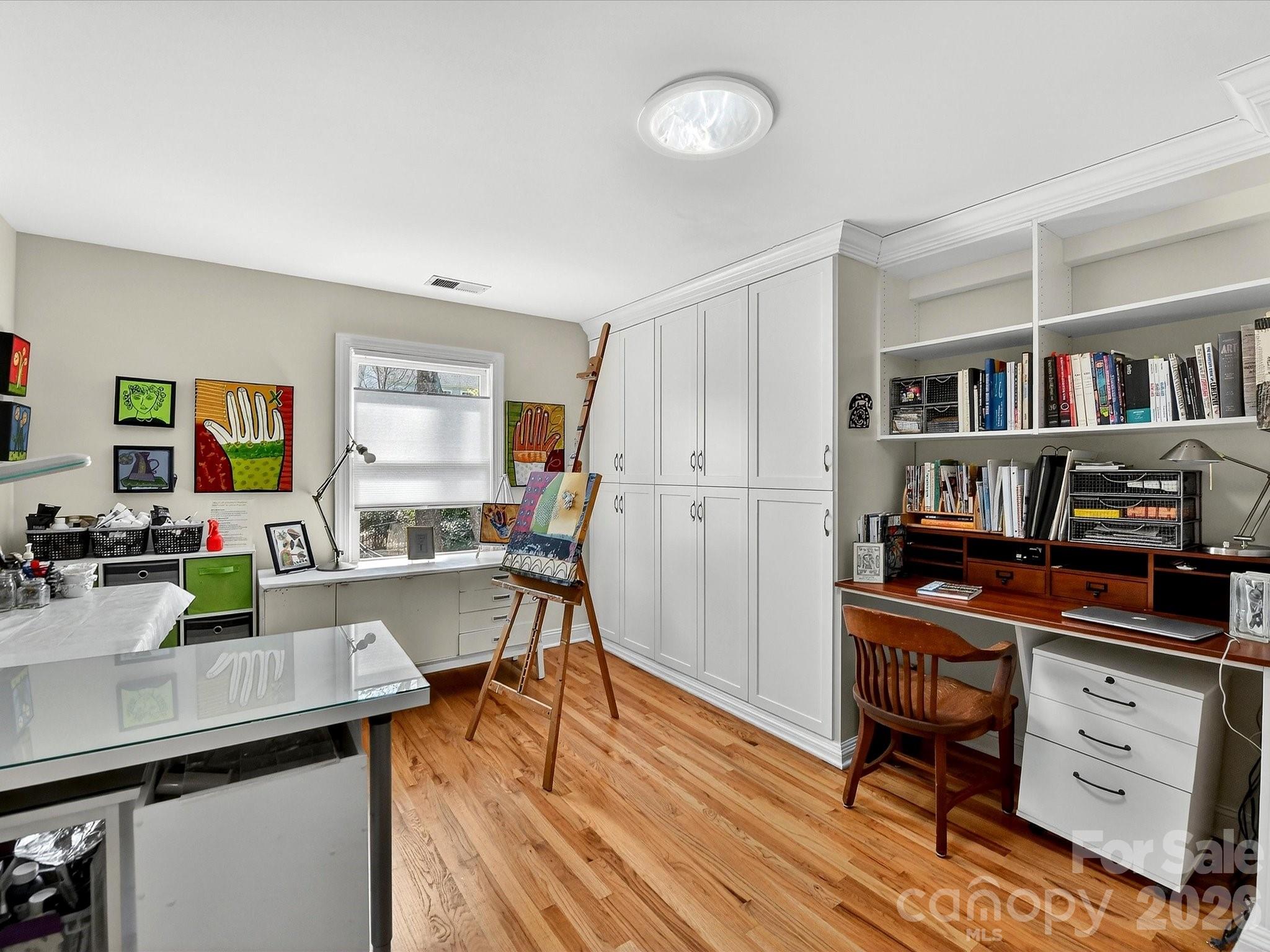 207 Hobbs Street Davidson, NC 28036 - Photo 28 of 40 a view of a workspace with furniture and wooden floor