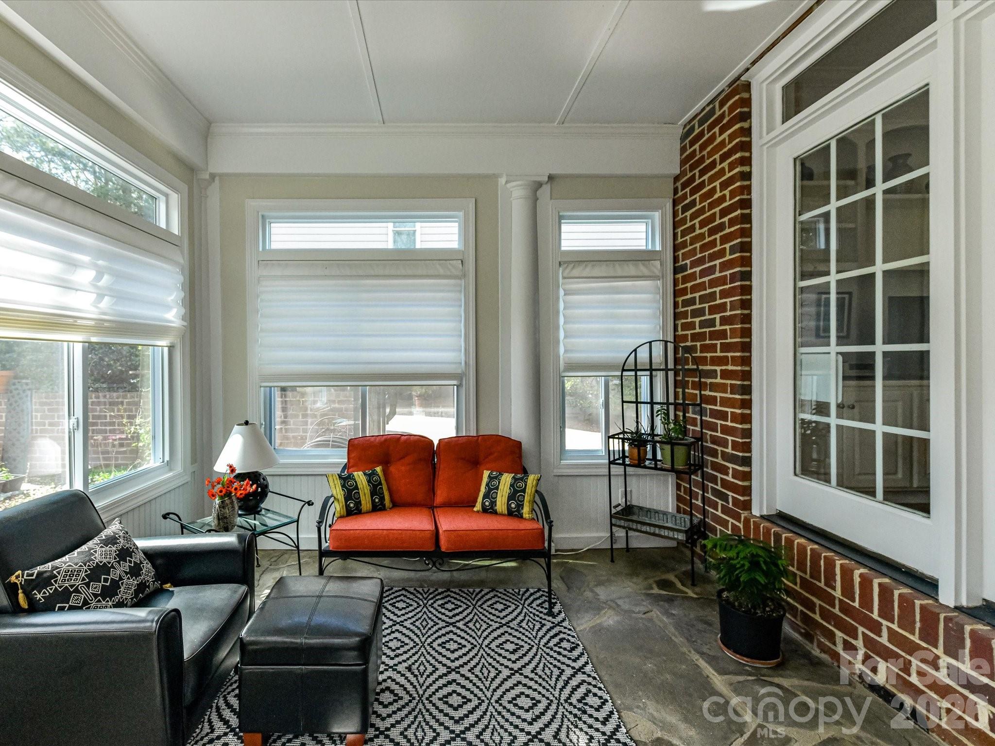 207 Hobbs Street Davidson, NC 28036 - Photo 30 of 40 a living room with furniture and a window