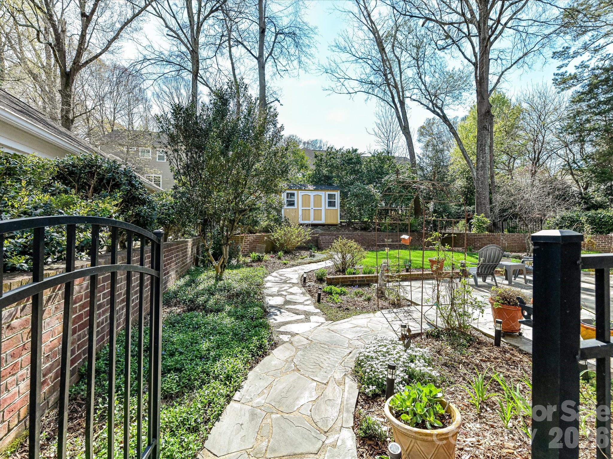 207 Hobbs Street Davidson, NC 28036 - Photo 33 of 40 a view of yard with furniture and trees