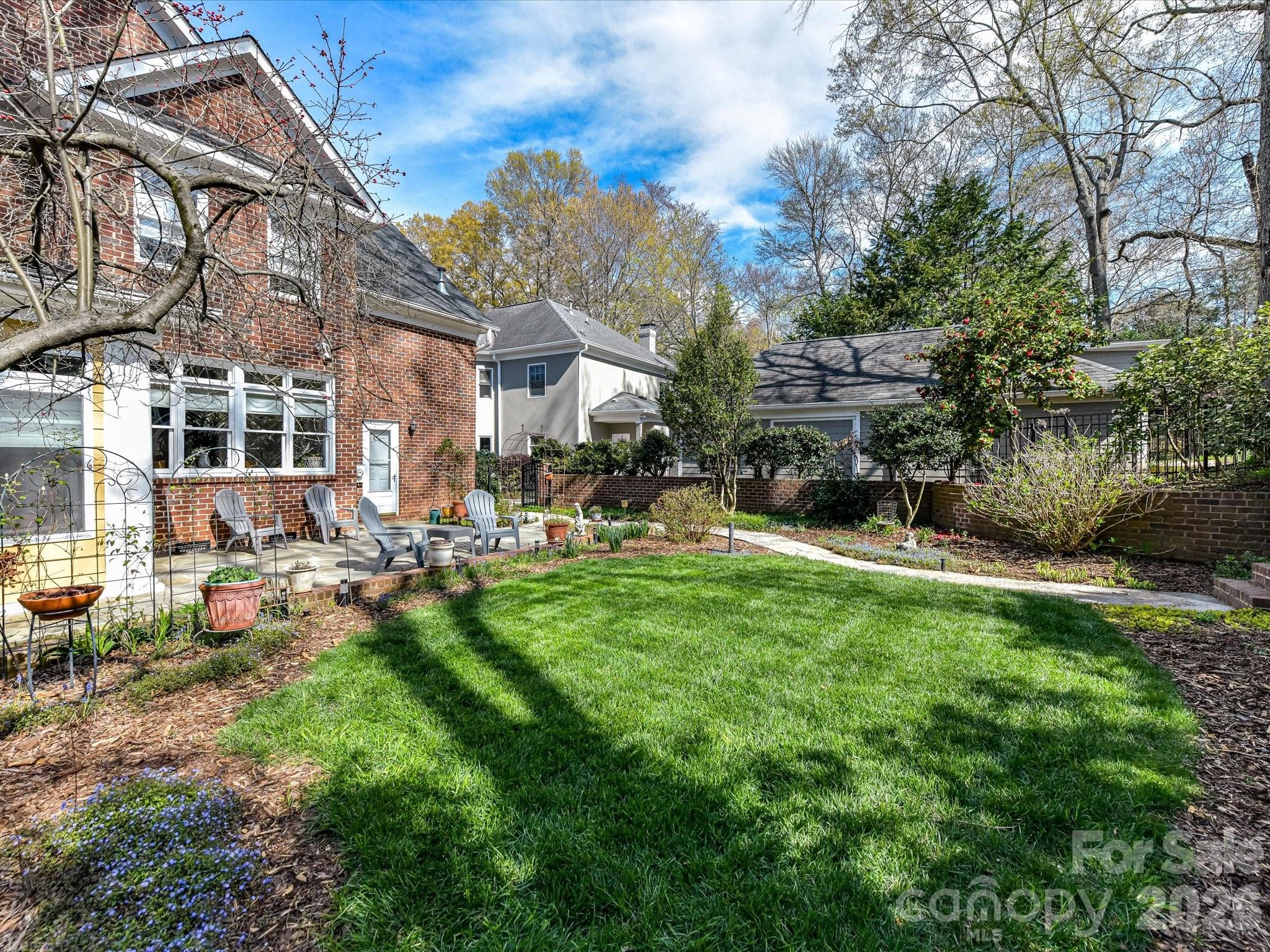 207 Hobbs Street Davidson, NC 28036 - Photo 34 of 40 a view of a building with a yard