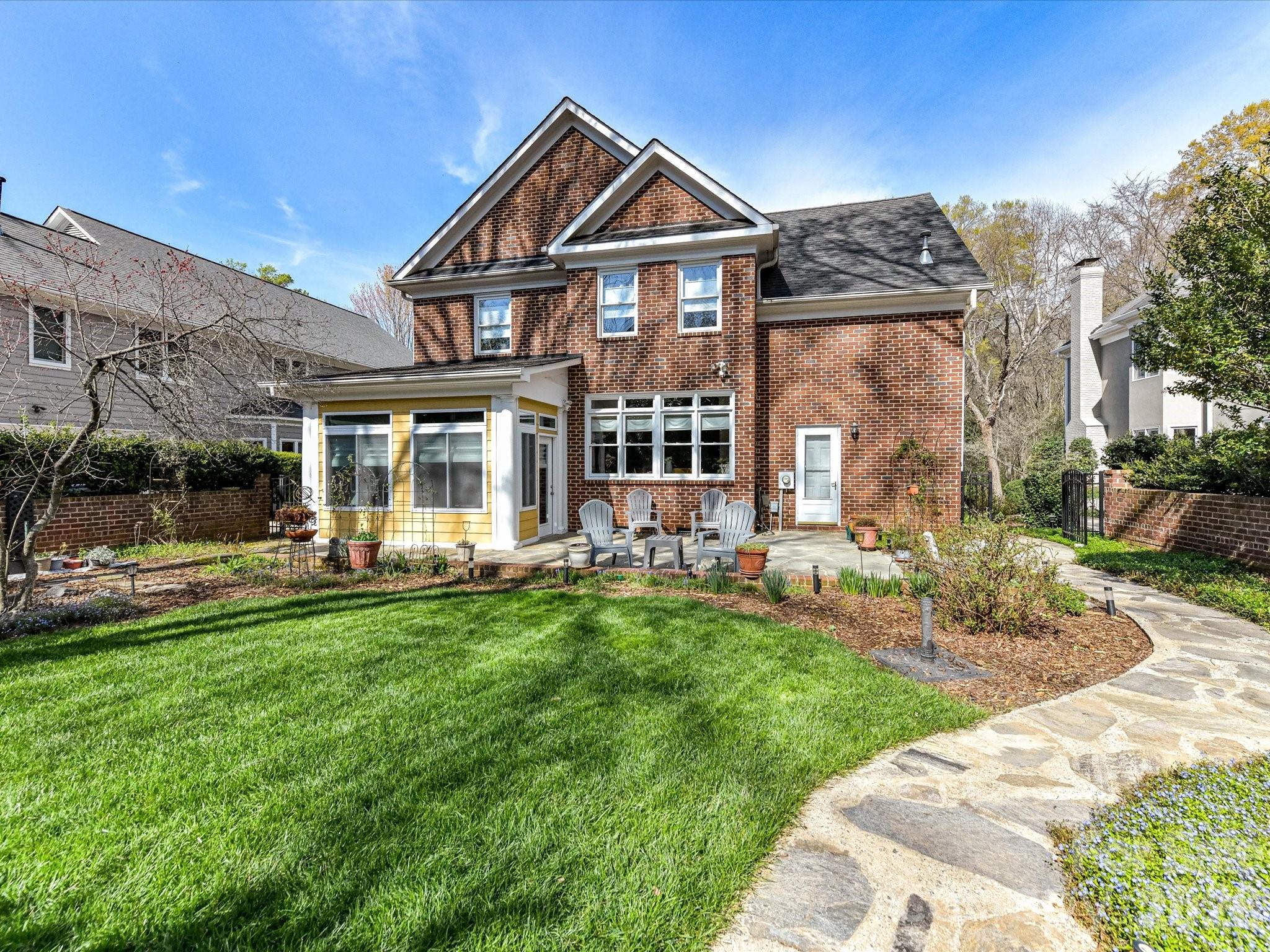 207 Hobbs Street Davidson, NC 28036 - Photo 35 of 40 a front view of a house with swimming pool having outdoor seating