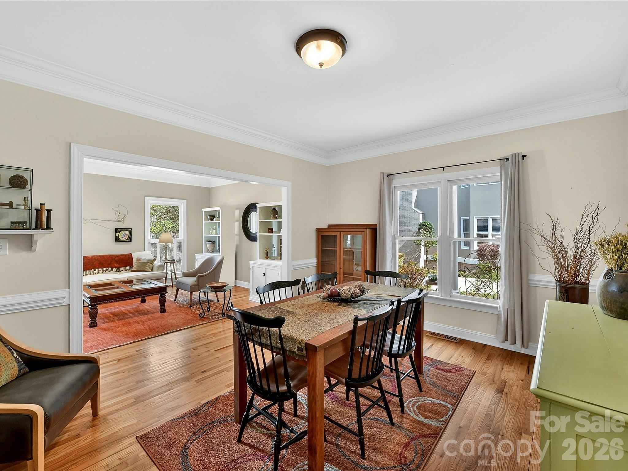 207 Hobbs Street Davidson, NC 28036 - Photo 8 of 40 a view of a dining room with furniture and wooden floor