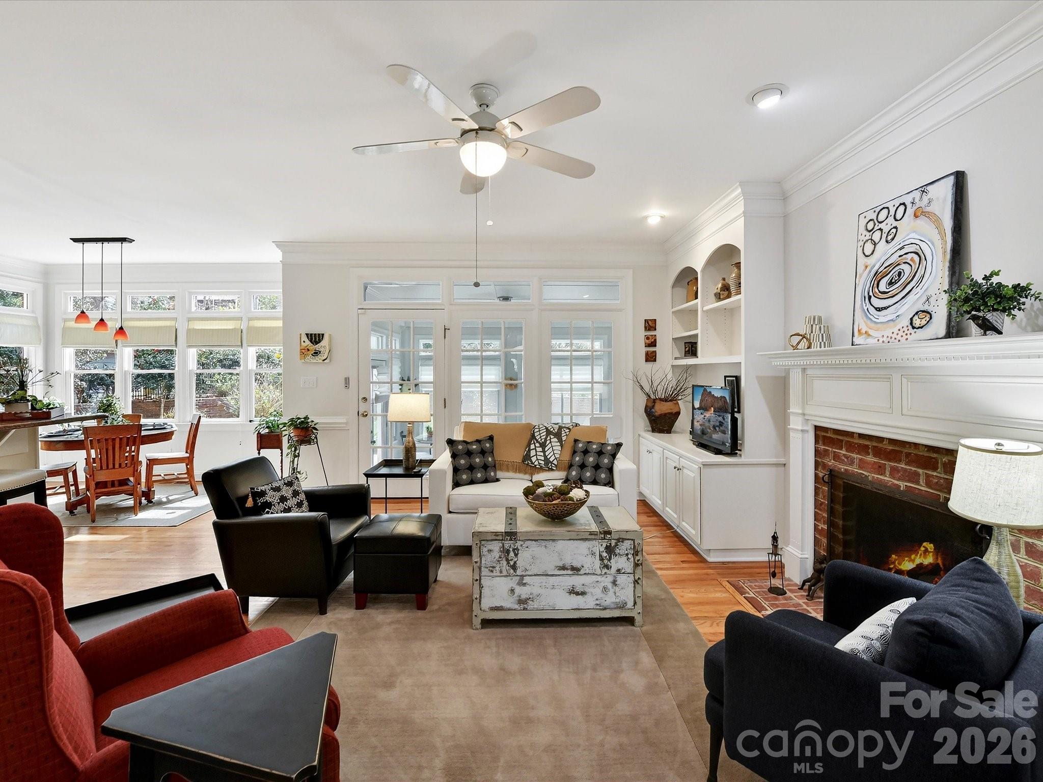 207 Hobbs Street Davidson, NC 28036 - Photo 10 of 40 a living room with furniture fireplace and a large window