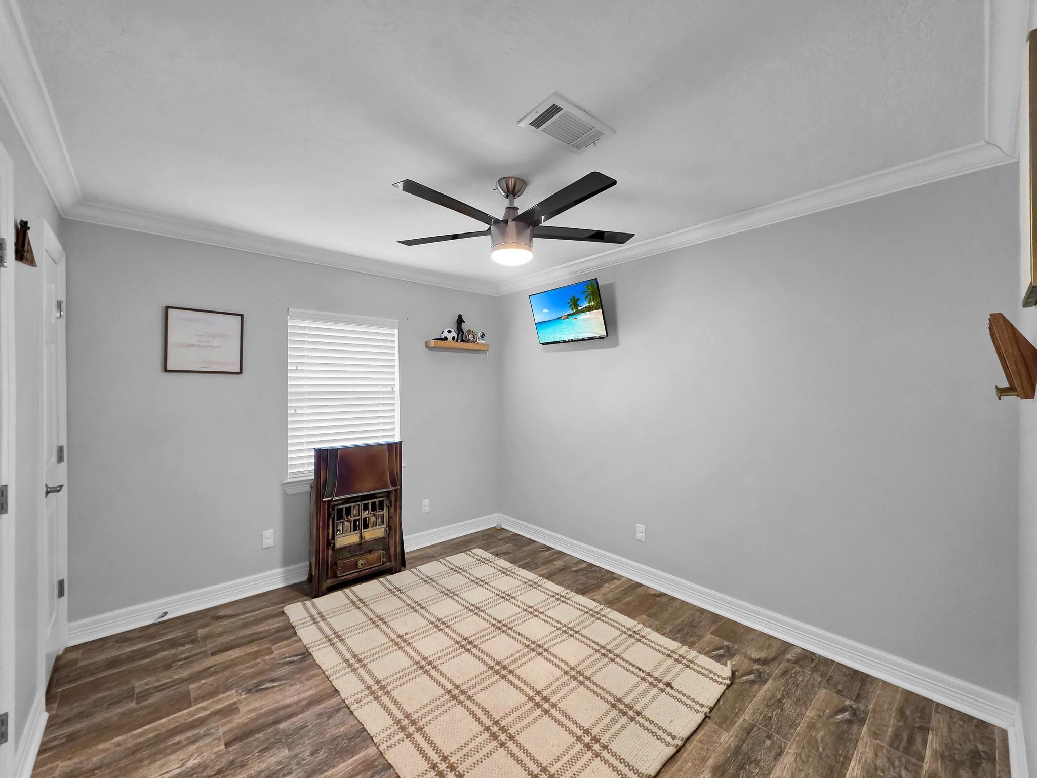 2641 Oilla Road Orange, TX 77630 - Photo 33 of 50 a view of livingroom with hardwood floor and a ceiling fan