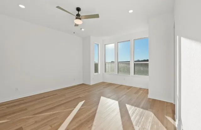 a kitchen with a sink a counter top space stainless steel appliances and cabinets