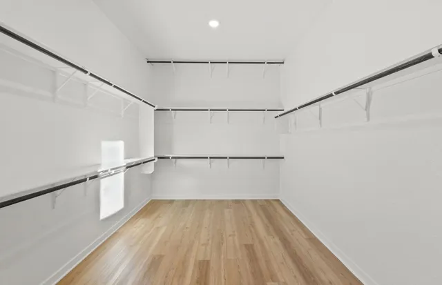 a bathroom with double vanity sinks and a mirror