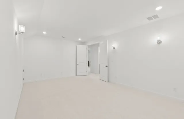 a bathroom with a granite countertop sink a toilet and a large mirror