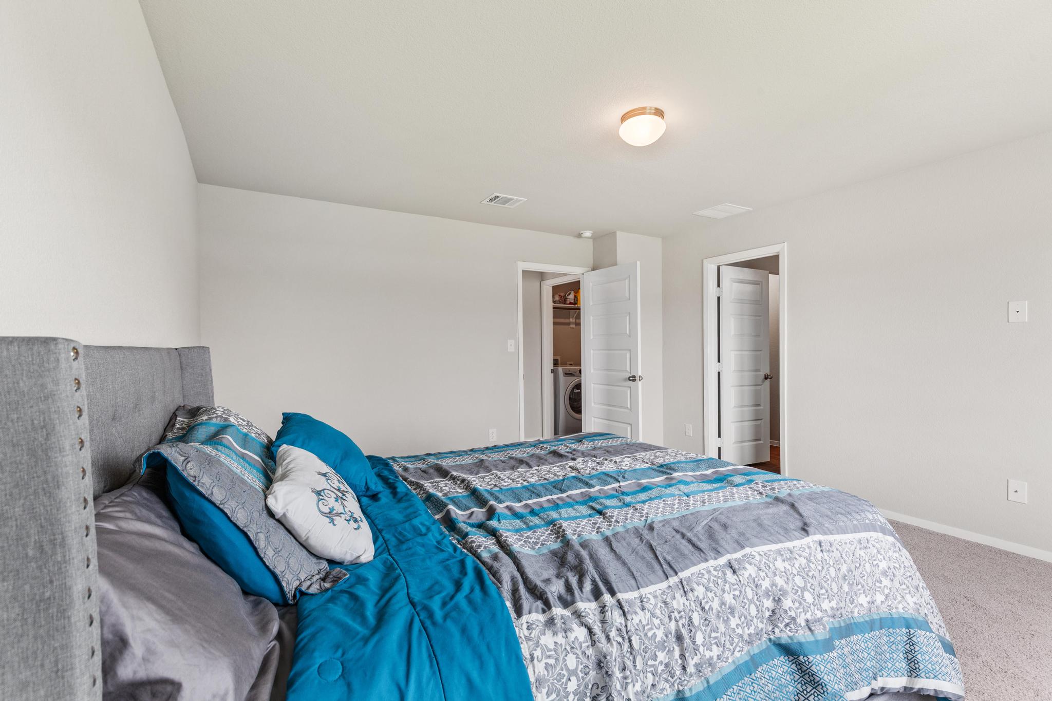 242 Barley Lane Elgin, TX 78621 - Photo 26 of 31 Carpeted bedroom featuring neutral wall tones and a ceiling-mounted light fixture