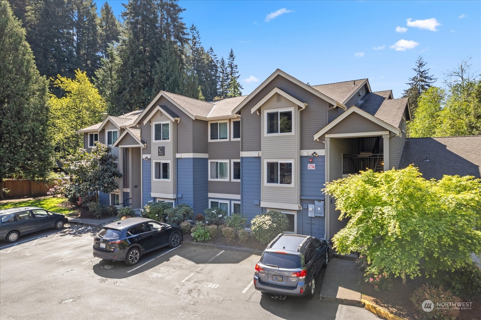 19316 Bothell Way Northeast, Unit C203 Bothell, WA 98011 - Photo 1 of 27 a front view of a house with a garden