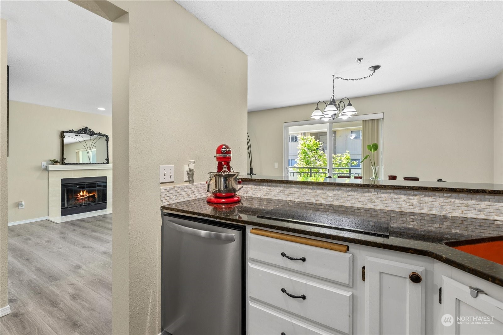 19316 Bothell Way Northeast, Unit C203 Bothell, WA 98011 - Photo 11 of 27 a kitchen with granite countertop a sink and cabinets