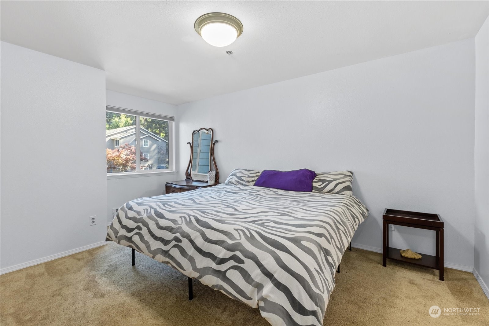 19316 Bothell Way Northeast, Unit C203 Bothell, WA 98011 - Photo 12 of 27 a bedroom with a bed and a window
