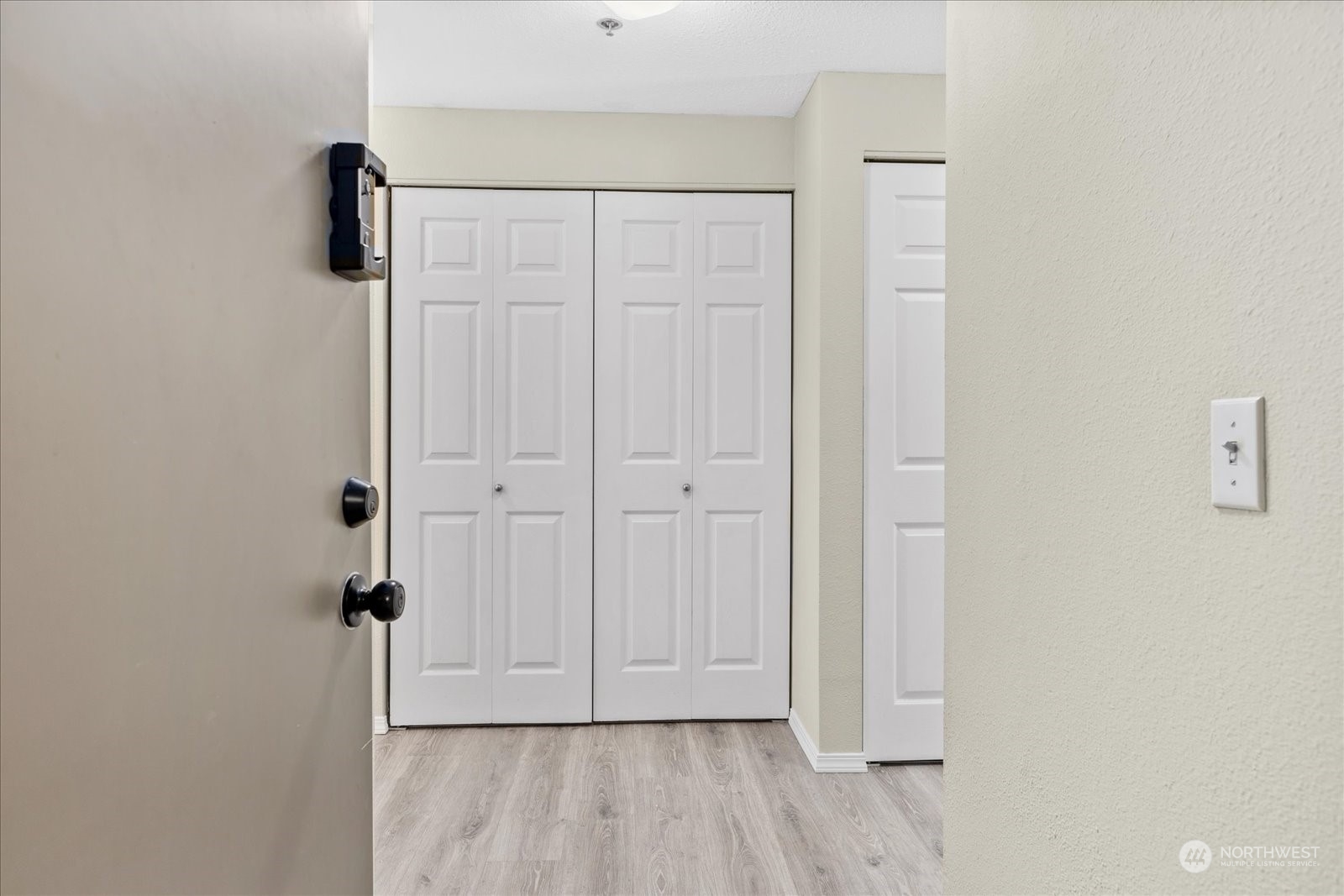 19316 Bothell Way Northeast, Unit C203 Bothell, WA 98011 - Photo 2 of 27 an entryway with wooden floor