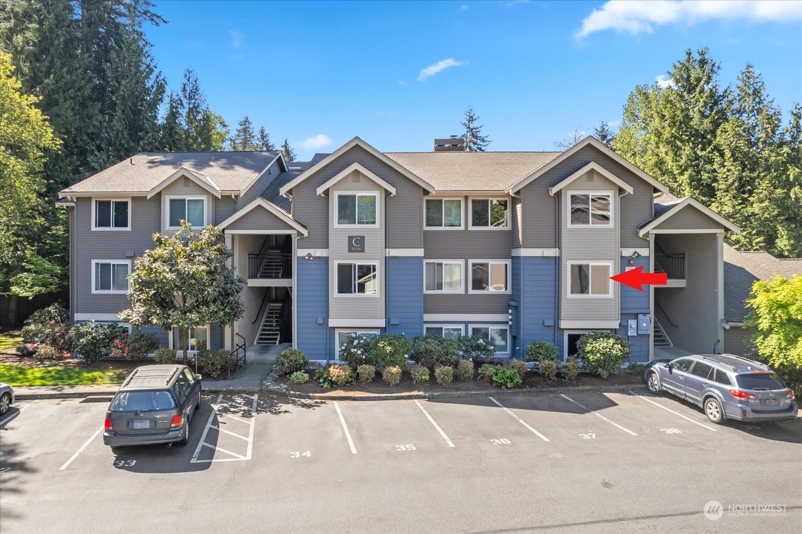 19316 Bothell Way Northeast, Unit C203 Bothell, WA 98011 - Photo 23 of 27 a front view of house with yard and green space