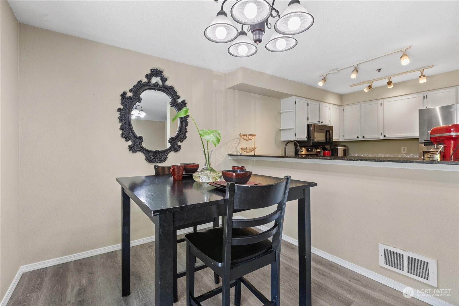 19316 Bothell Way Northeast, Unit C203 Bothell, WA 98011 - Photo 7 of 27 a kitchen with a dining table and chairs
