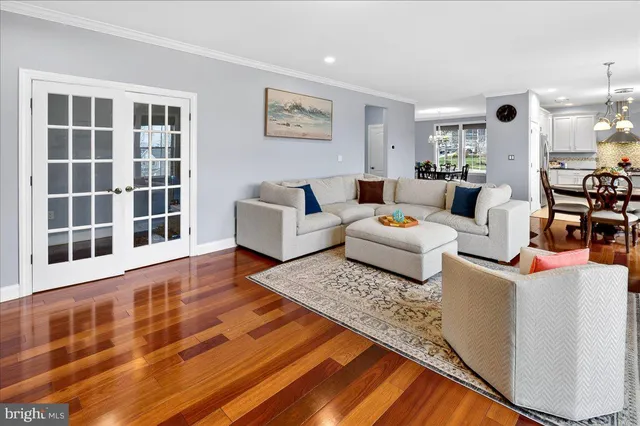a living room with furniture and windows