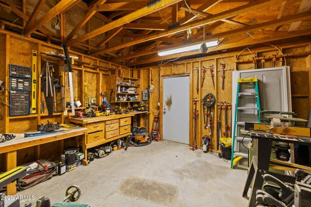 walk in closet with wooden floor