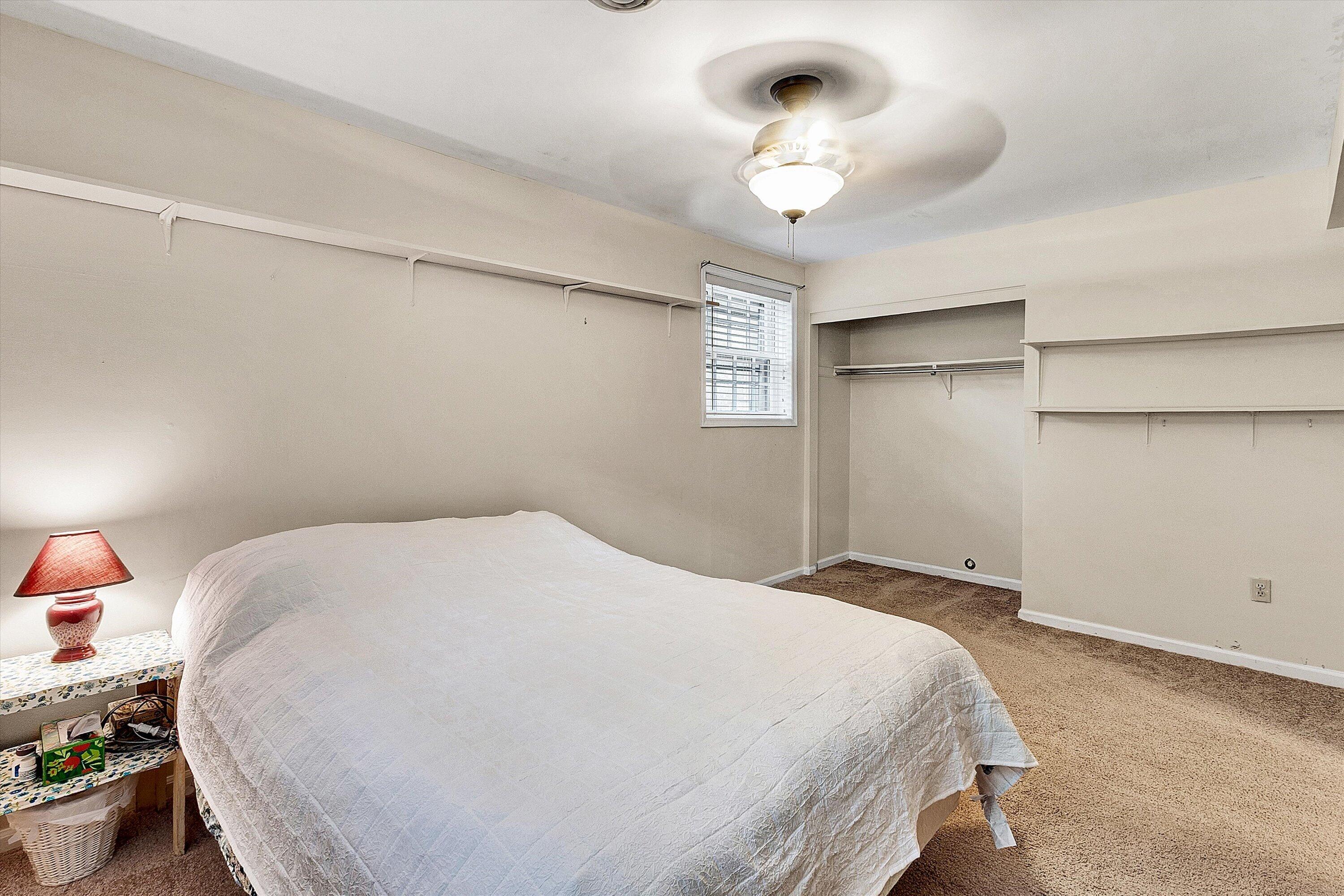 912 Cherokee Trail Covington, VA 24426 - Photo 21 of 31 a bedroom with a bed and a chandelier