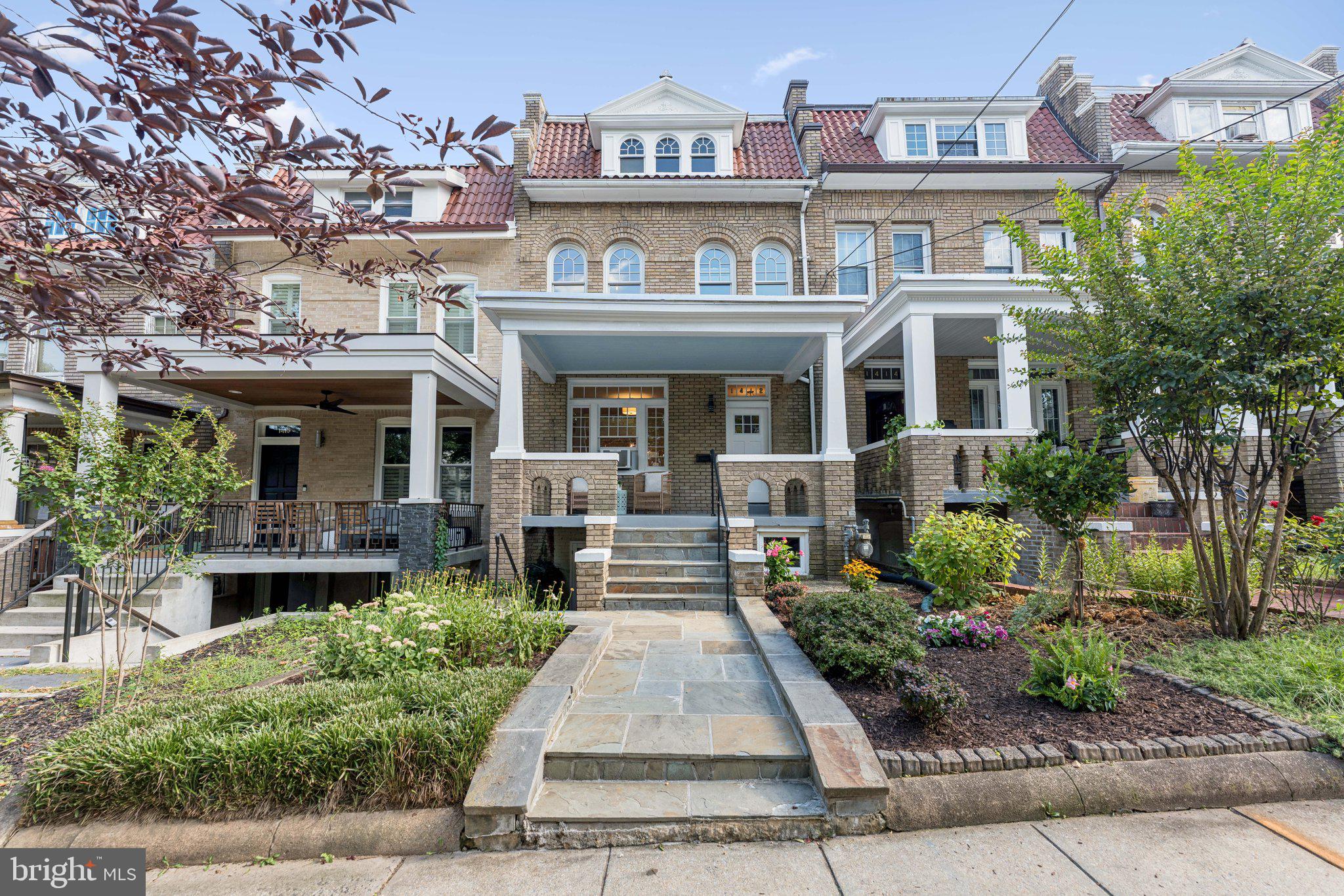 1412 Decatur Street Northwest Washington, DC 20011 - Photo 1 of 36 a front view of a residential apartment building with a yard