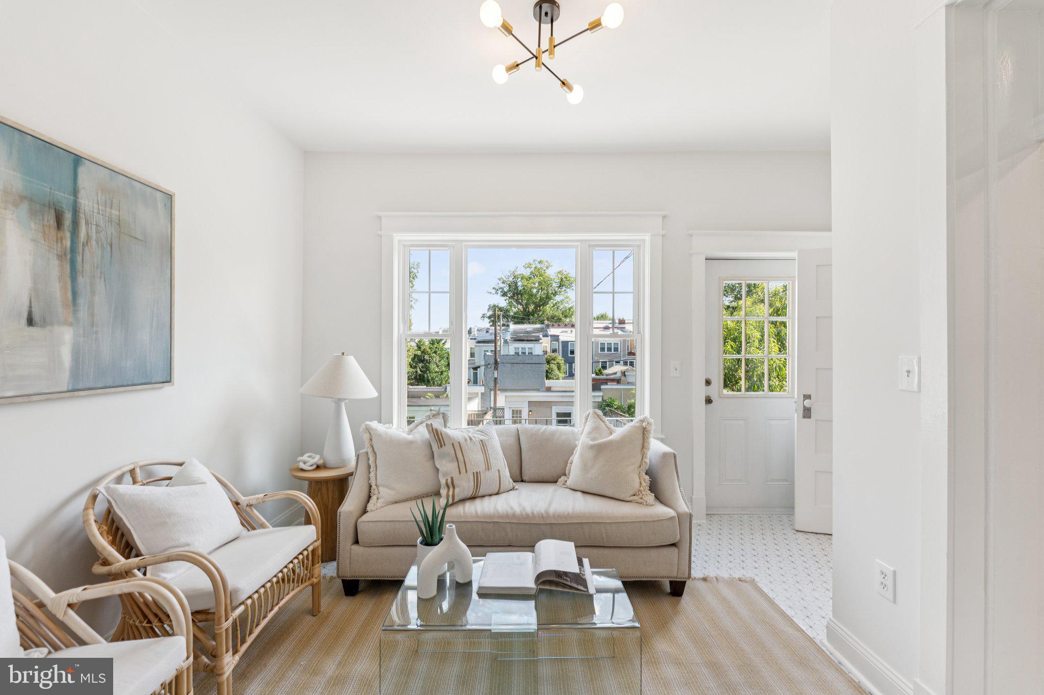 1412 Decatur Street Northwest Washington, DC 20011 - Photo 12 of 36 a living room with furniture and a large window