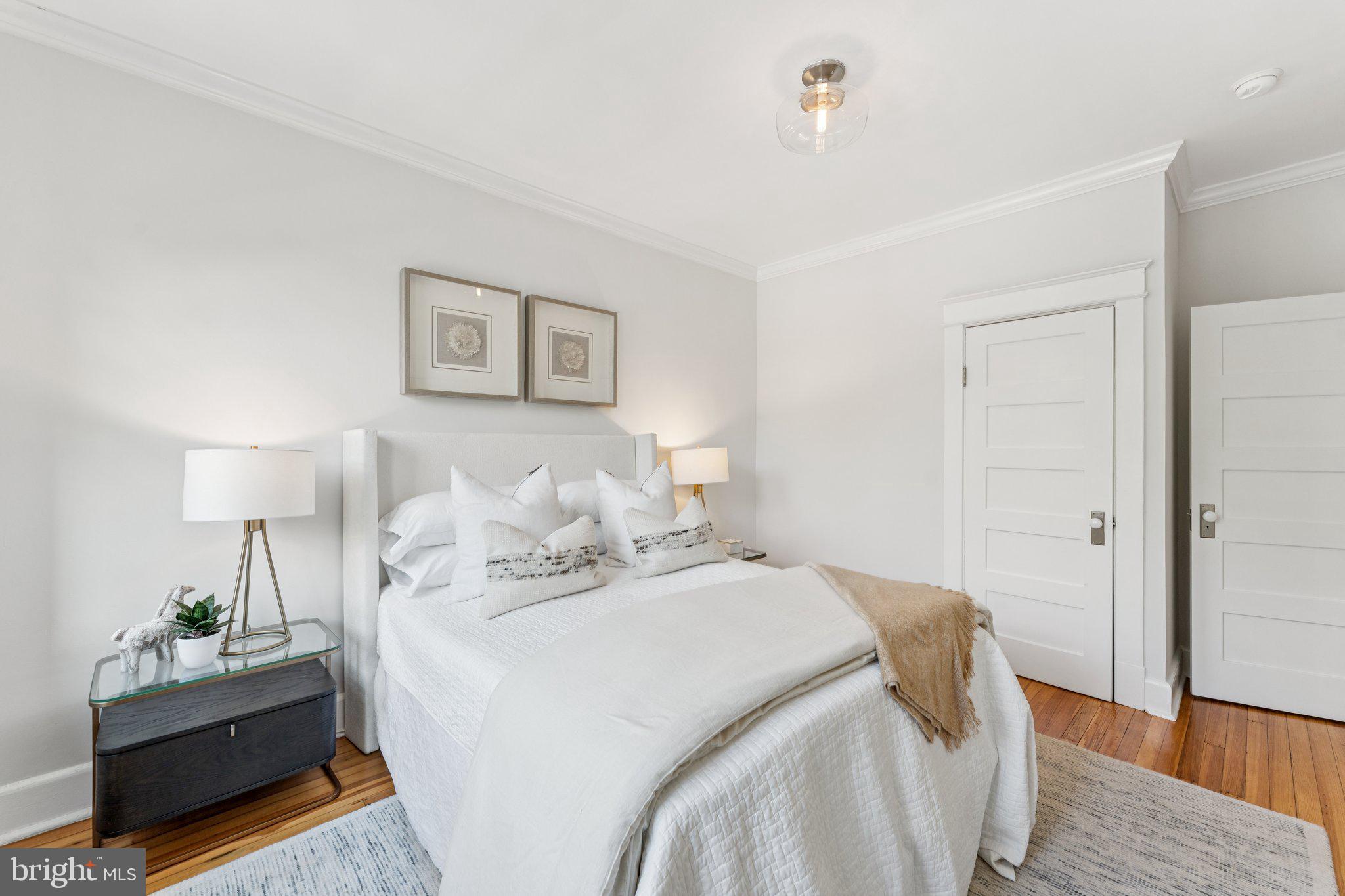 1412 Decatur Street Northwest Washington, DC 20011 - Photo 21 of 36 a bed room with a bed and a night stand