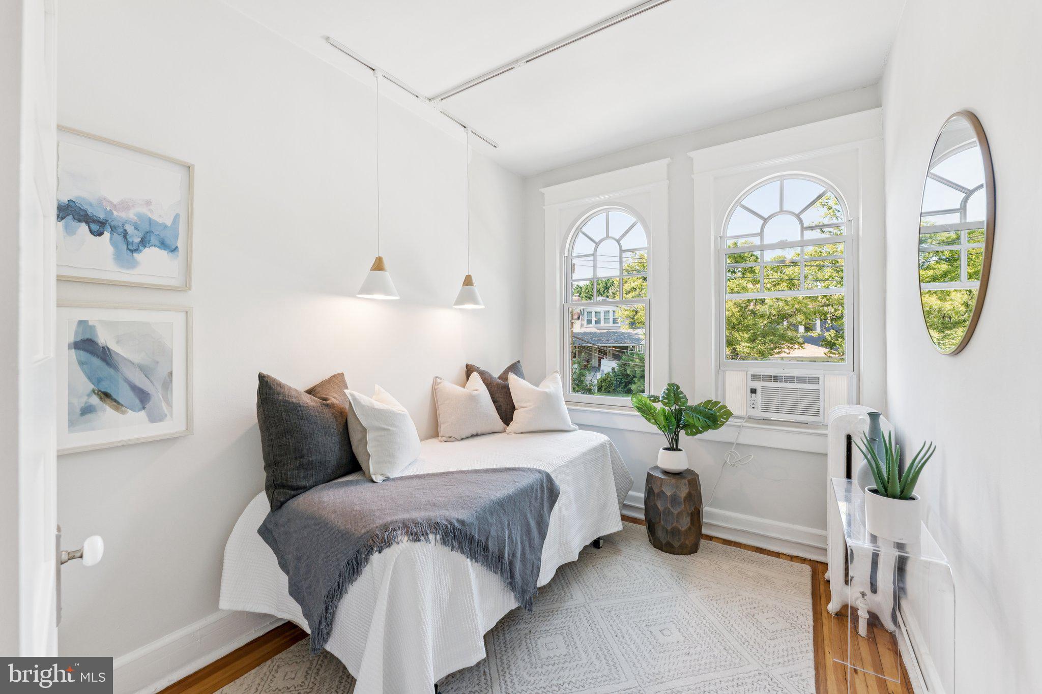 1412 Decatur Street Northwest Washington, DC 20011 - Photo 23 of 36 a bedroom with a bed and a painting on the wall